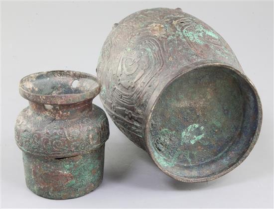 A Chinese archaic bronze ritual drinking vessel and cover, Hu, Western Zhou dynasty, 11th-9th century B.C., 30cm high, faults
